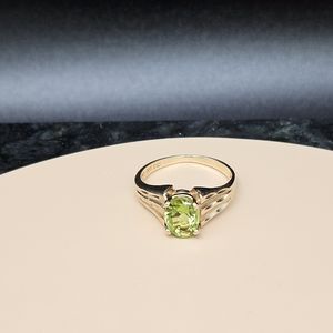 14k Gold ring with green Peridot oval stone